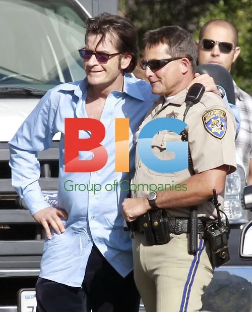Charlie Sheen and Katheryn Winnick on film set