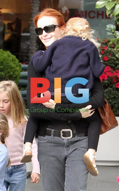 Marcia Cross out with twin daughters