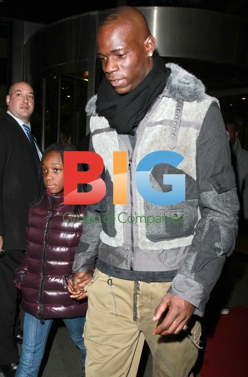 Mario Balotelli and Girlfriend Leave Hotel with Child