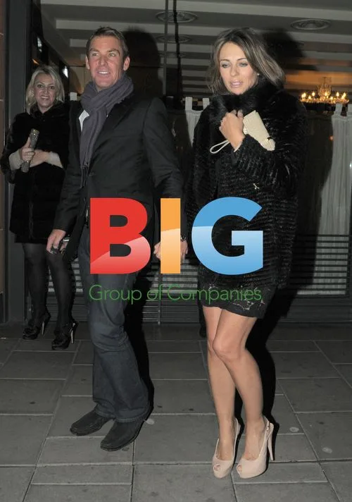 Liz Hurley and Shane Warne out in London