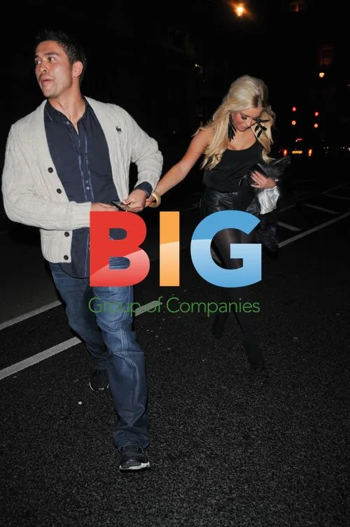 Rav Wilding and girlfriend leaving Aura