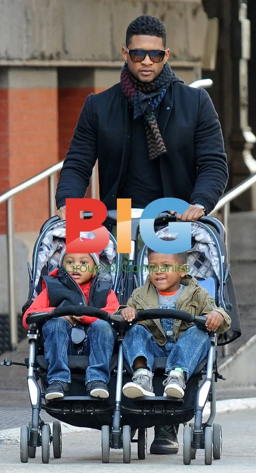 Usher with kids shopping in NYC