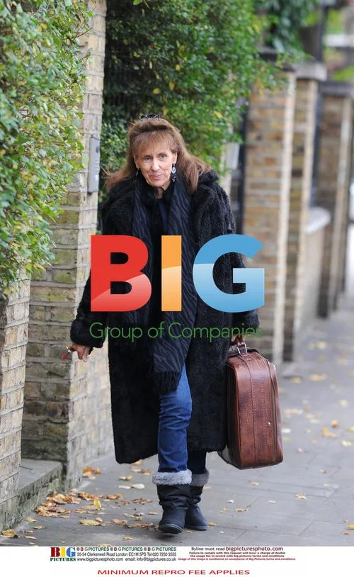 Anita Dobson Leaving Home with Luggage