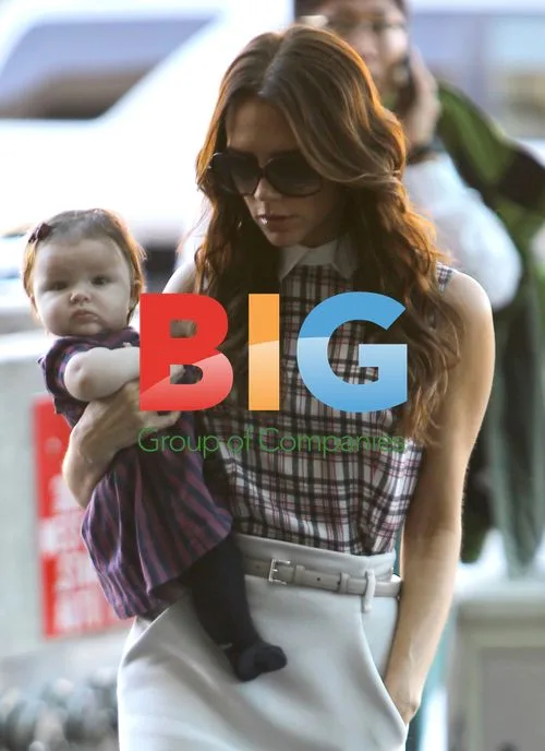 Victoria Beckham Carries Daughter Harper at LAX