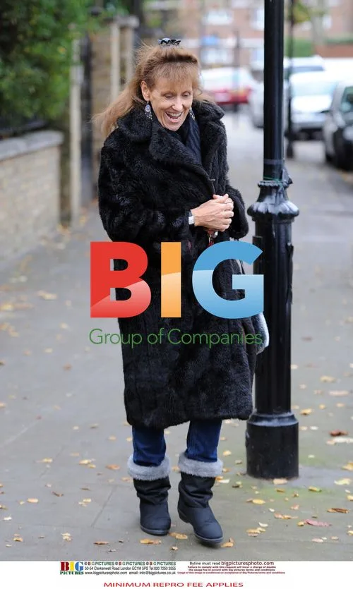 Anita Dobson Leaving Home with Luggage