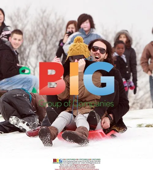 Russell Brand and Katy Perry Sledding