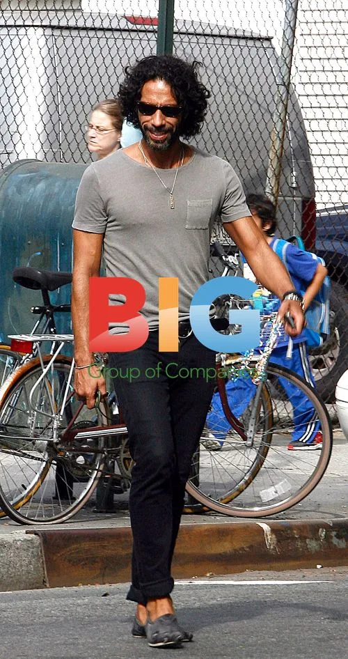 Carlos Leon walks in Soho, NYC
