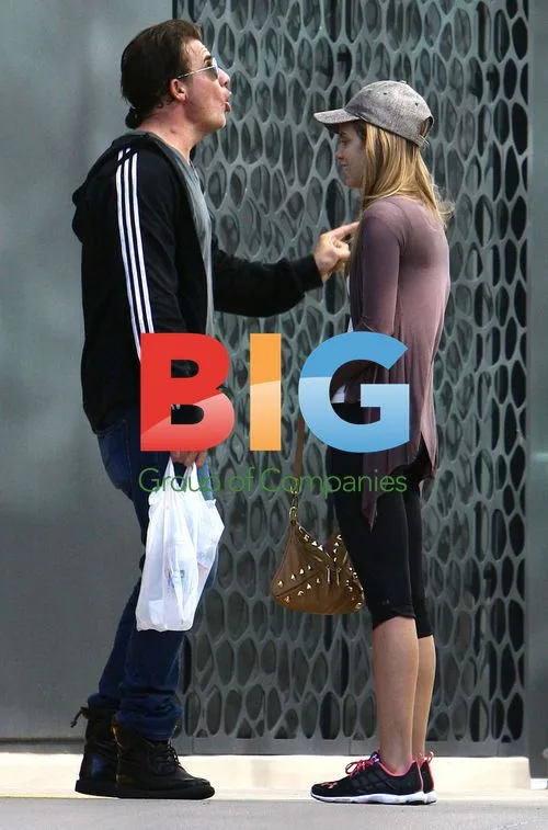AnnaLynne McCord and Dominic Purcell in animated conversation