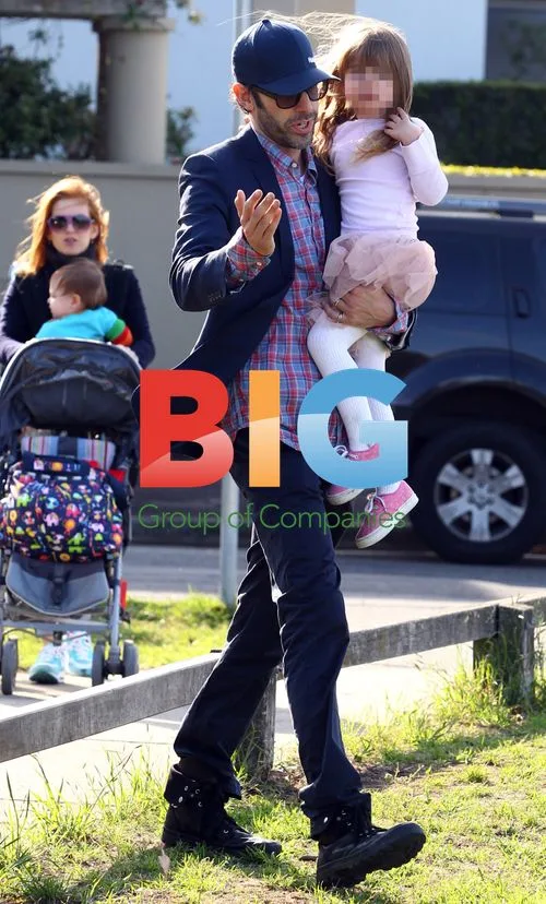 Sacha Baron-Cohen and Isla Fisher with kids