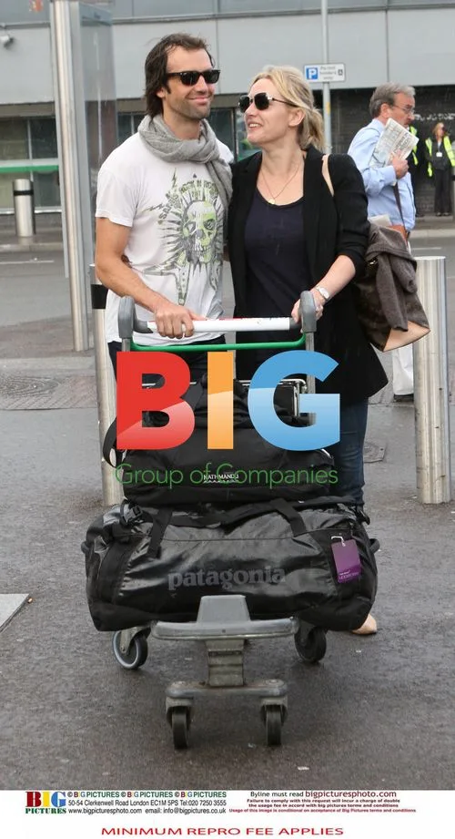 Kate Winslet with boyfriend Ned Rocknrolla at Heathrow