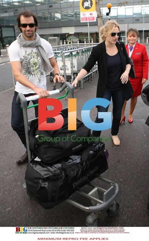 Kate Winslet Spotted with Boyfriend at Airport