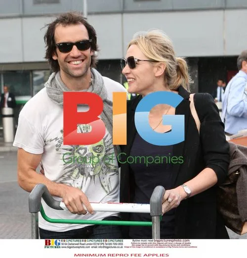 Kate Winslet at Heathrow with Boyfriend