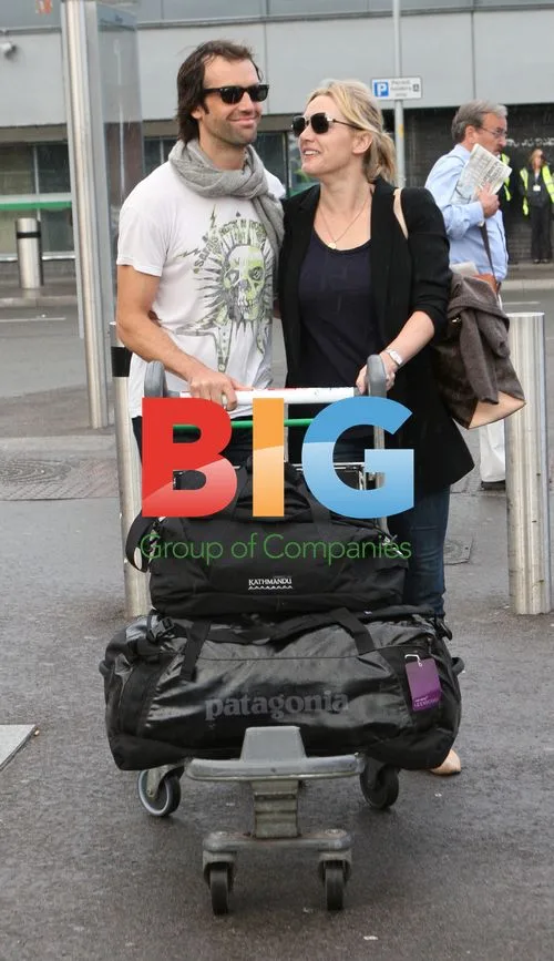 Kate Winslet and Ned Rocknrolla at Heathrow