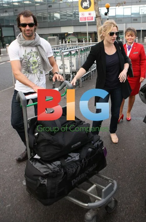 Kate Winslet and Ned Rocknrolla at Heathrow