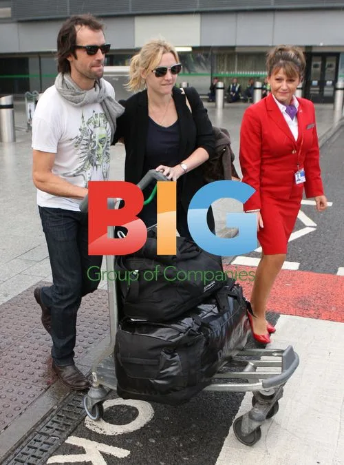 Kate Winslet with boyfriend Ned Rocknrolla at Heathrow