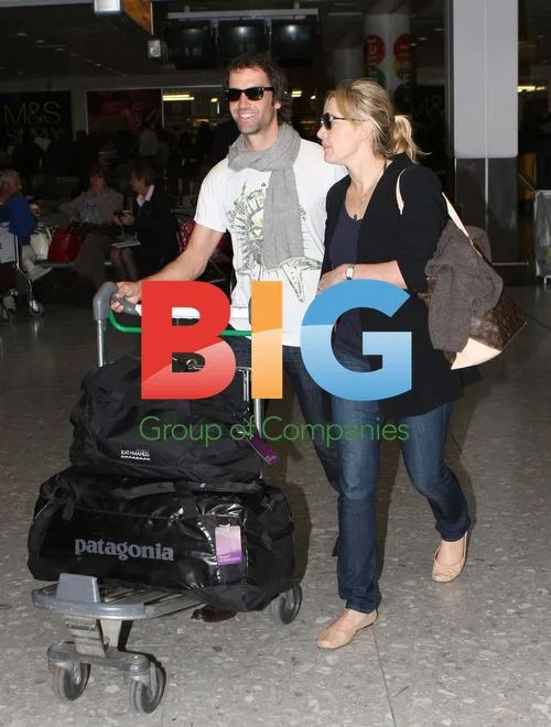 Kate Winslet Seen at Heathrow with Boyfriend