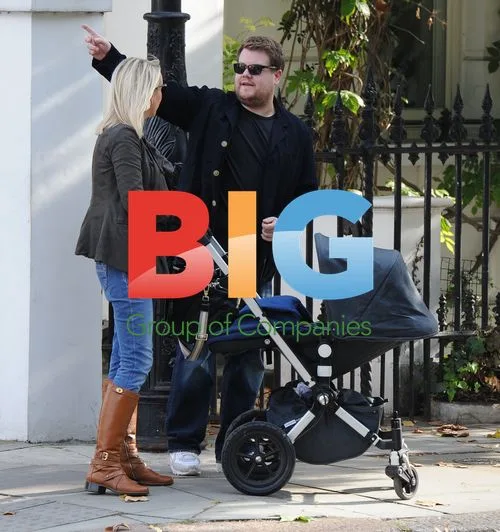 James Corden and family catch cab in London