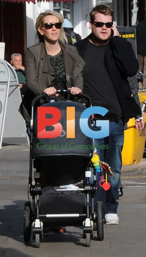 James Corden and Family Catch Cab in London