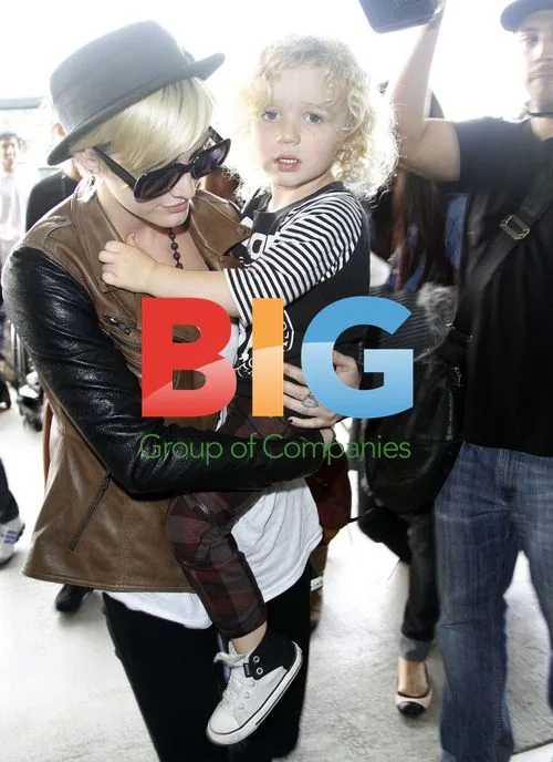Ashley Simpson, son Bronx Wentz, and Jessica Simpson at LAX