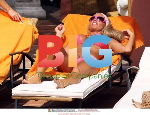 Katie Price Relaxes Poolside in Spain