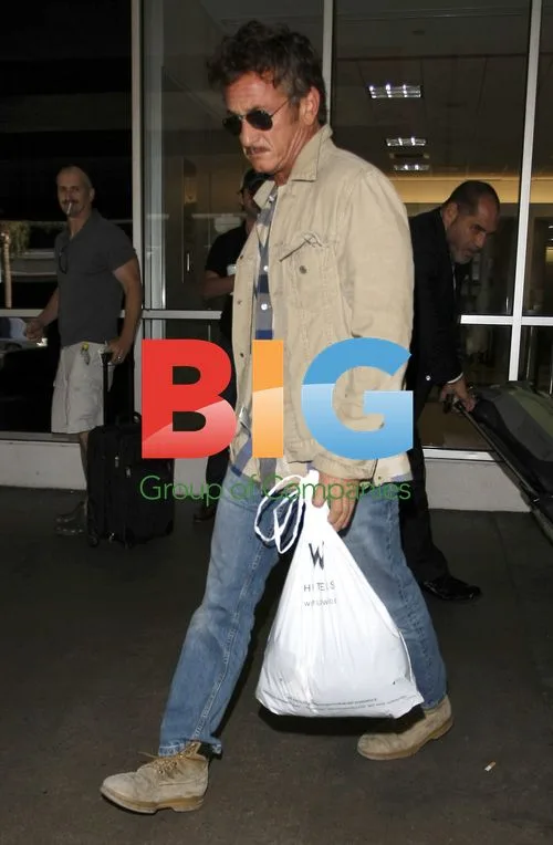 Sean Penn & Shannon Costello Arrive at LAX