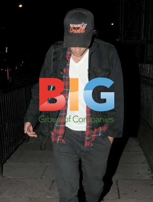 Robert Pattinson Walks in London