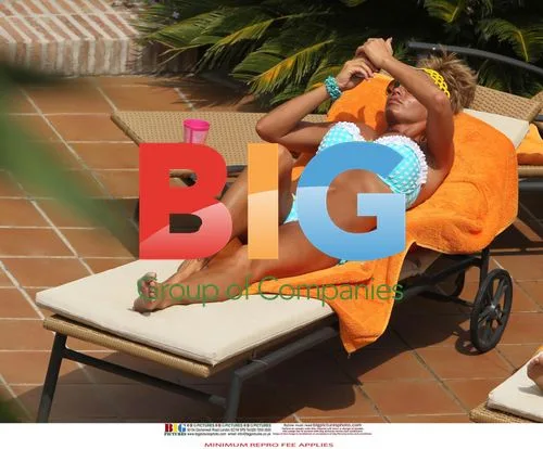 Katie Price Relaxes Poolside in Spain