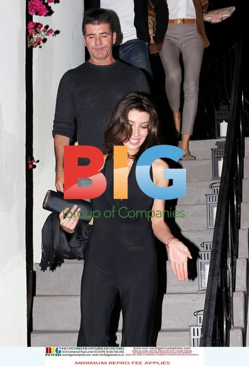 Simon Cowell leaves friend's house with fiance
