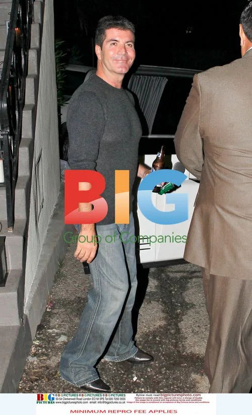Simon Cowell and Mezhgan leave house after X Factor premiere