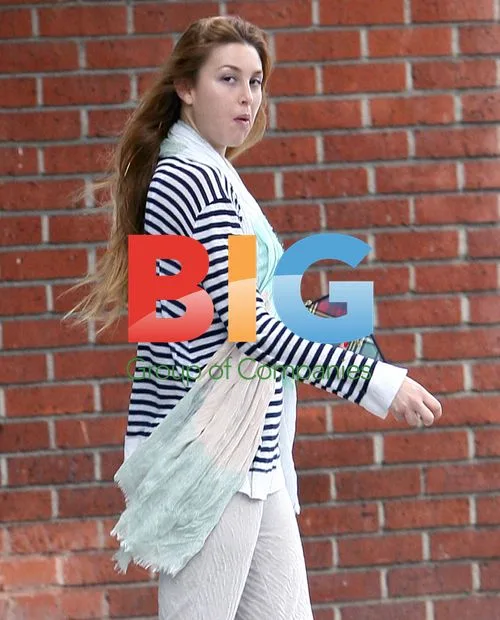 Whitney Port gets a tan with her sister