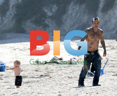 Seth Brooks Binzer shirtless with girlfriend and baby