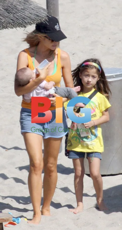 Denise Richards Relaxes with New Adopted Baby