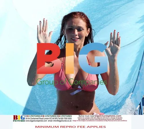 Amy Childs Enjoys Waterslide in Pink Bikini