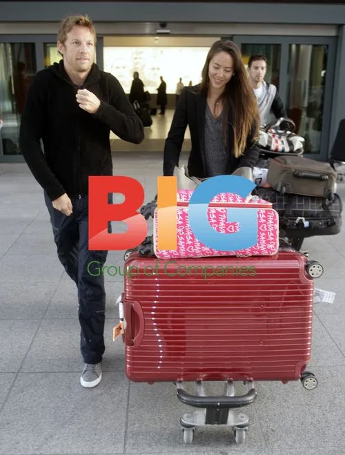 F1 Driver Jenson Button Arrives at Heathrow