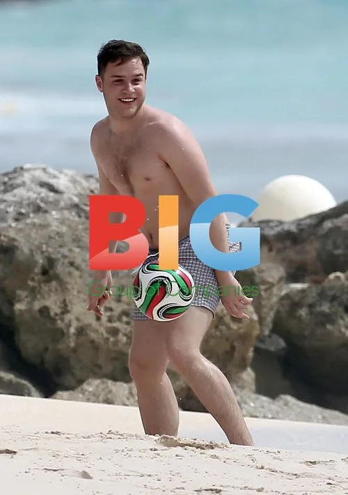Olly Murs Playing Football on Beach