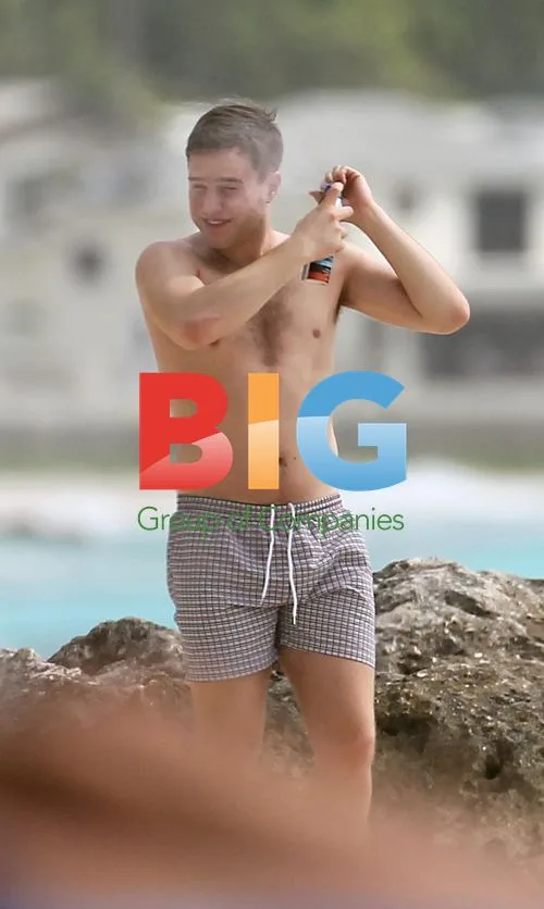 Olly Murs plays football on Caribbean beach