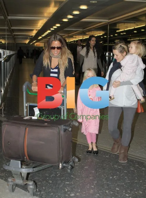 Caroline Flack Returns From India
