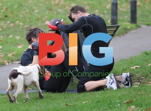 George Lamb Exercises with Trainer and Dog