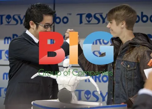 Justin Bieber plays with mRobo robot at CES 2012