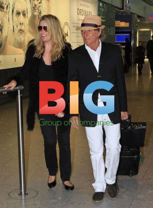 Rod Stewart and family arriving at Heathrow