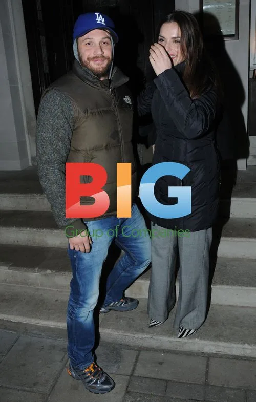 Tom Hardy and Noomi Rapace outside restaurant