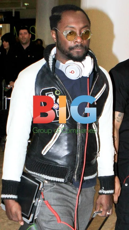 Will.i.Am Arriving at Heathrow Airport