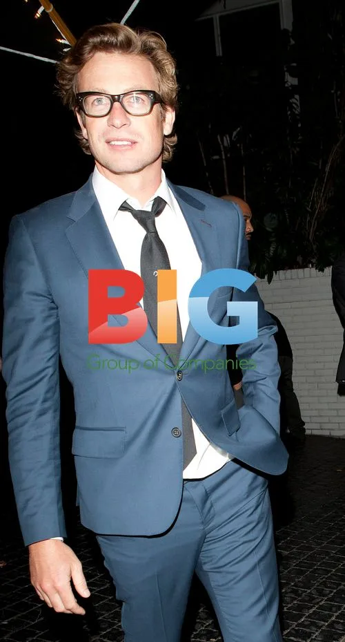 Actor Simon Baker leaves hotel
