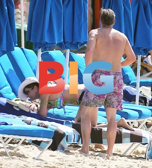 Glenn Hoddle relaxes on beach with wife