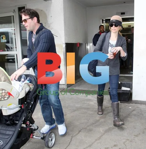 Elizabeth Banks and husband at LAX with baby