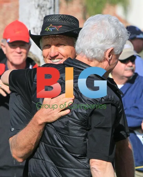 Greg Norman Embraces Bill Clinton at Humana Challenge
