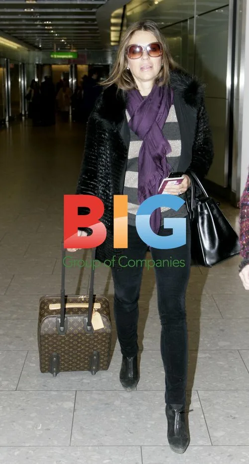 Elizabeth Hurley Arrives at Heathrow Airport