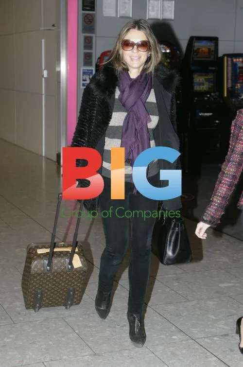 Elizabeth Hurley Arrives at Heathrow Airport