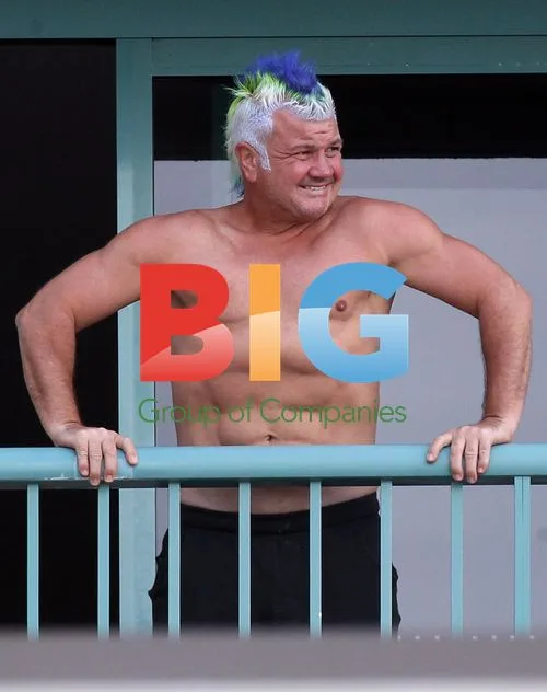 Darryn Lyons Shows Off Abs with Girlfriend