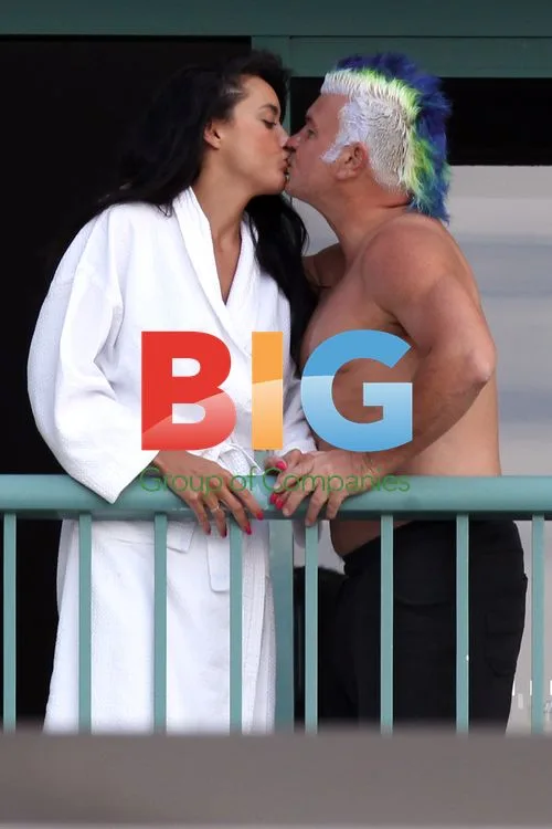 Darryn Lyons Flaunts Abs on Hotel Balcony